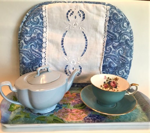 Blue setting for tea tasting. with Blue Cozy, Blue Teapot and Blue Teacup