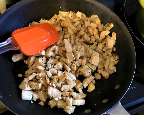 chicken breast cut up and sauteing in pan
