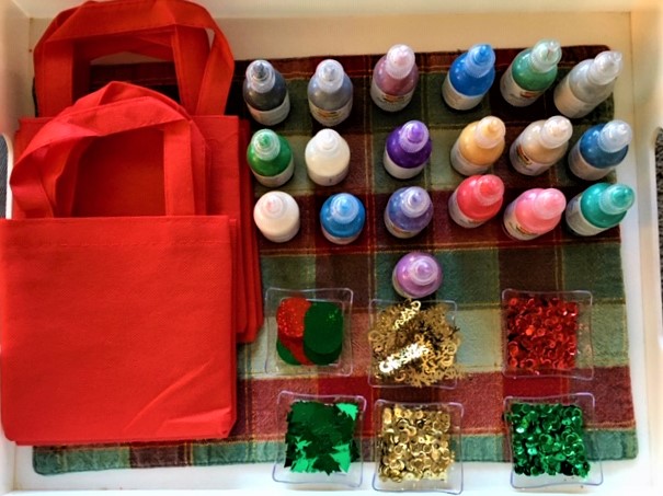 Craft box ready with bags, puff paints, and embellishments - the take home gift from the Cocoa Tea Party