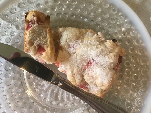 A single Strawberry Cream scone plated and ready to enjoy