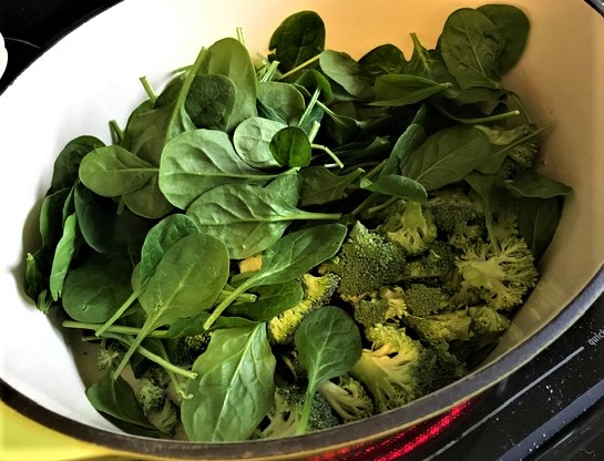 Broccoli and spinach in cooking pot