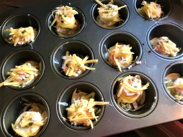 Cheesy Thyme and Ham Potato Gratin Stacks ready for the oven