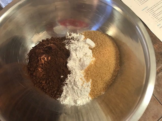 Dry ingredients for bittersweet chocolate quick bread - bittersweet cocoa, flour, and sugar in the raw