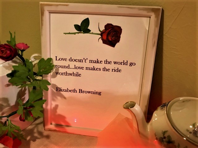 Entrance table Valentine quote in frame.