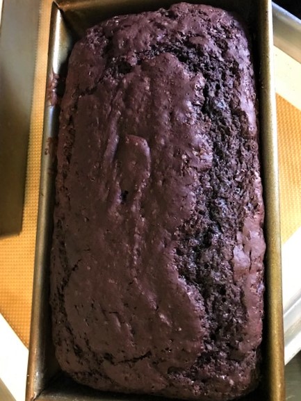 Baked loaf of Bittersweet Chocolate Quick Bread out of the oven.