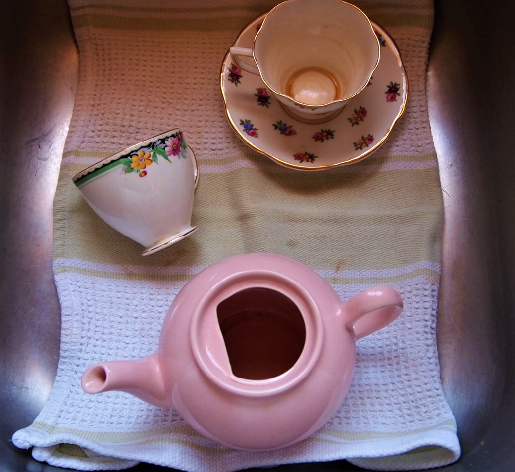 How to Care for your Vintage China - china in the sink with a towel