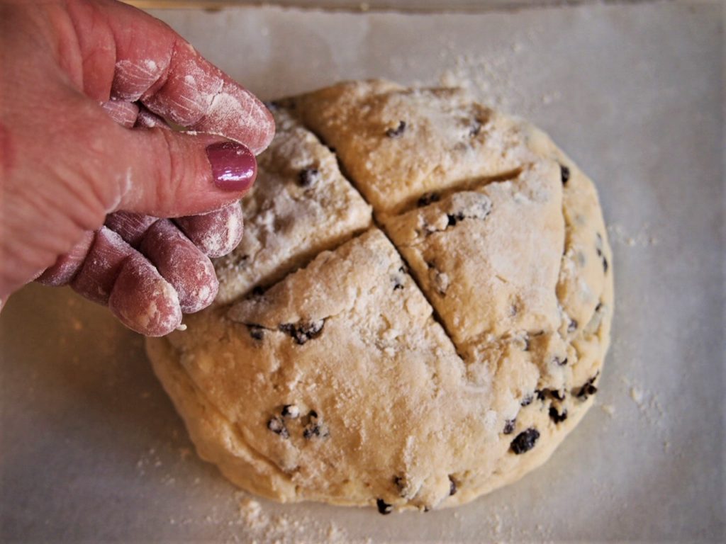 An Easy Irish Soda Bread recipe - Ready to bake with "x" and dusting of flour